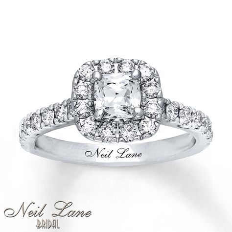 This stunning engagement ring from Neil Lane Bridal® showcases a 3/4 carat cushion-cut diamond framed with round diamonds. More round diamonds flow along the 14K white gold band, bringing the total diamond weight to 1 3/8 carats. The ring features Neil Lane's signature on the band. Diamond Total Carat Weight may range from 1.37 - 1.44 carats. Neil Lane Engagement Rings, Pink Diamond Engagement Ring, Neil Lane, Rare Jewelry, Sea Jewelry, Stunning Engagement Ring, Cushion Cut Diamonds, Halo Engagement Rings, White Gold Band