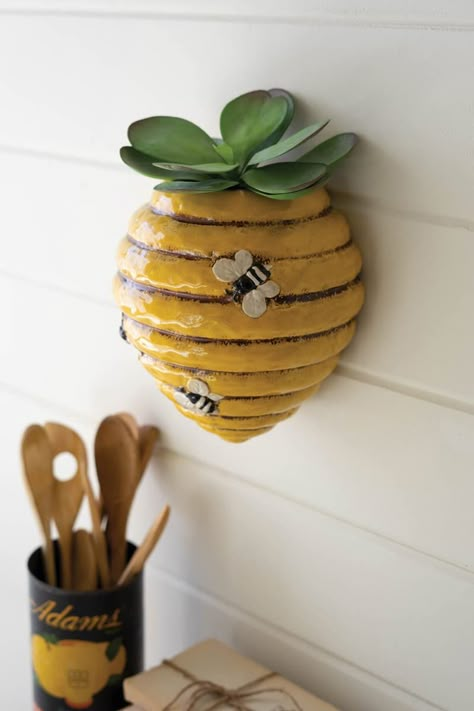 PRICES MAY VARY. Color: Yellow, Black, White Material: Glazed Ceramic Measures: 7.5" x 6" x 9"t Function: Wall Hanging Planter Decor Style: Cottage Care Instructions: Wipe with a lint-free cloth This planter is practically buzzing with style. Perfect for apiary enthusiasts or someone you think is the bee's knees. Hang on the wall for a pretty hive planter. Garden Ceramics, Ceramic Wall Planters, Wall Planters Indoor, Self Watering Plants, Bee's Knees, Keyhole Hanger, Plastic Planters, Ceramic Pots, Hang On