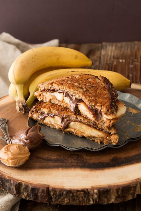 grilled nutella peanut butter and banana sandwich ohsweetbasil.com Nutella And Banana, Nutella Sandwich, Toast Hawaii, Biscuits Diététiques, Banana Sandwich, Peanut Butter Nutella, Banana Nutella, Peanut Butter Sandwich, Grilled Cheese Recipes