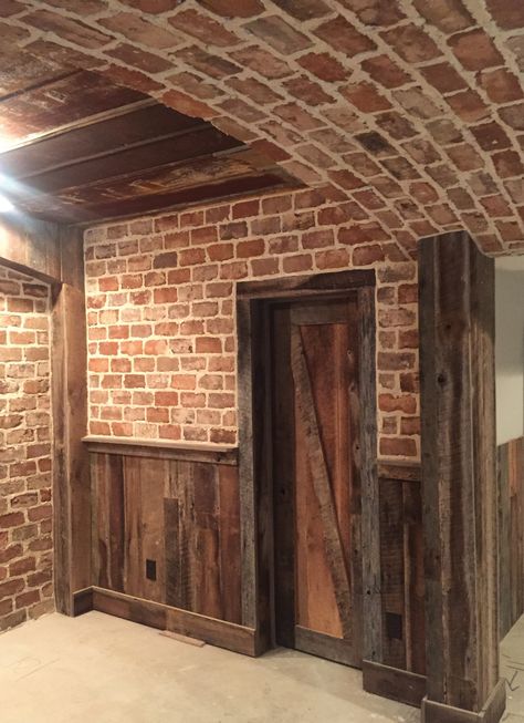 Want to make a new home look historic? Salvaged bricks can do the trick. - Atlanta Magazine Reclaimed Brick Wall, Antique Brick Wall, Wood Walls Bedroom, Brick Room, Rustic Basement, Antique Brick, Recycled Brick, Brick Interior, Pole Barn House Plans