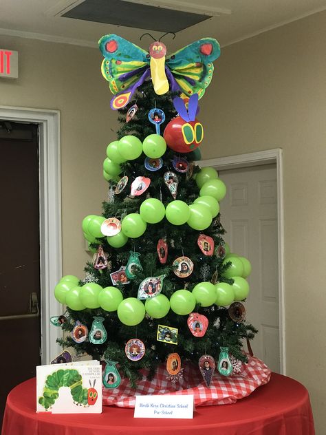 The Very Hungry Caterpillar Christmas Tree Library Themed Christmas Tree, Storybook Christmas Tree, Class Christmas Tree Ideas, Work Christmas Tree Themes, Cheap Christmas Tree Decor, Kids Christmas Tree Themes, Festival Of Trees Ideas, Library Christmas Tree, School Christmas Tree