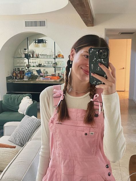 girl in pink overalls aesthetic with two braids and ribbon in hair pink phone mirror selfie Pink Overall Dress Outfit, Pink Overalls Aesthetic, Cute Overalls Aesthetic, Pink Teacher Aesthetic, Pink Teacher Outfit, Teacher Overalls Outfit, Pink Dungarees Outfit, Overalls Spring Outfit, Pink Overalls Outfits