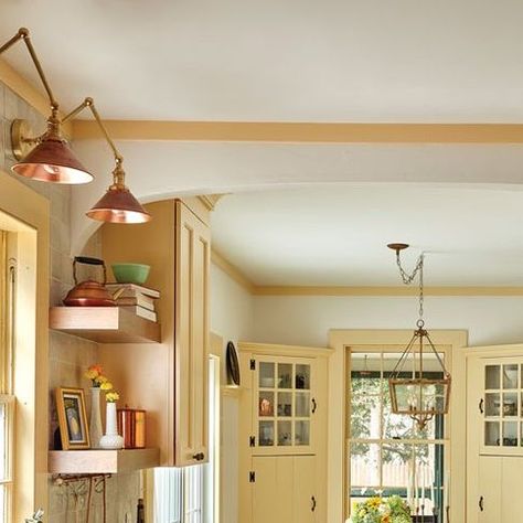 Maine Homes by Down East on Instagram: "Layers of paint on the original cabinets in this 1928 Fryeburg kitchen suggested they’d always been yellow, a shade the owners liked. So when the couple, who asked that their names be withheld, contemplated white cabinetry for their renovated space, designer Hannah Guilford, co-owner with her husband, Cody, of Fryeburg’s @heartandhammerhomes, had some advice: “I said, ‘Your house isn’t a White House. The colors here are working; let’s just make them better.’” She specced @sherwinwilliams’s Butter Up — a softer take on the previous mustard — for their new cabinets, new built-in dining bench, and original woodwork and china cabinets. Tap the link in our bio to read more about this kitchen and four more Maine kitchens we love. Story: @sarahstebb Phot Butter Kitchen Cabinets, Pale Yellow Cabinets Kitchen, Pale Yellow Kitchen Cabinets, Butter Yellow Kitchen, Pale Yellow Kitchens, Built In Dining Bench, Yellow Kitchen Cabinets, Yellow Cabinets, Yellow Kitchen