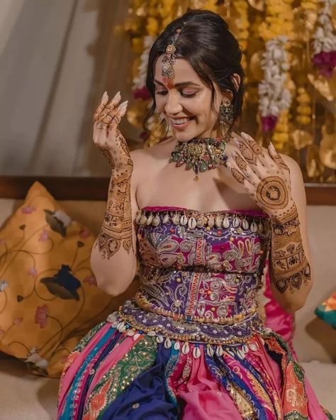 Swooning over Esha Kansara’s enchanting mehendi look! 🌟 Her vibrant multicolored lehenga paired with stunning jewelry creates pure magic. Swipe to be inspired by this mesmerizing style! 💚 . . Couple: Esha Kansara & Siddharth Amit Bhavsar⁠ Outfit by: @annu_patel1402 , annus_creation⁠ Jewellery: @aesha.desaii , @tamraa.bespokejewelry⁠ Mehndi: @jayshreebridalmehandi⁠ Photographer: @karmaproduction_india⁠ Hair: @_hair.by.freya_⁠ Makeup: @theglitterboxbyshreyapatel⁠ Event managed by: @anc_events ... Multicolored Lehenga, Esha Kansara, Mehendi Look, Simple Lehenga, Mehendi Outfits, Bride Pictures, Style Couple, Bridal Outfit, Wedding Entertainment