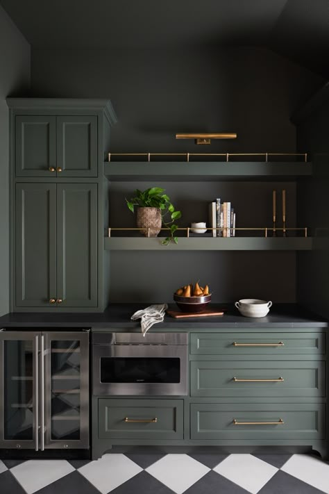 Beyond the kitchen hustle, the butler's pantry stands ready—organized elegance for the modern host. Dark Green Butlers Pantry, Moody Butlers Pantry, Black Cabinets Butlers Pantry, Jean Stoffer Butlers Pantry, Teal Butlers Pantry, Dark Pantry, Kitchen With Butlers Pantry, Dark Green Kitchen, Kitchen Ornaments