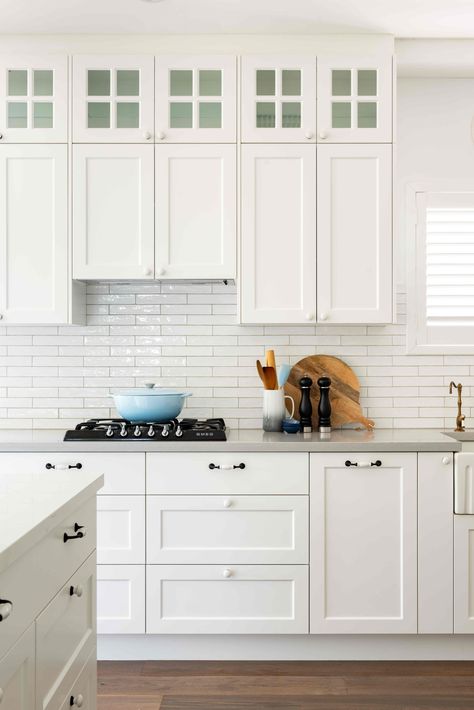 Inspired by The Hamptons of Long Island, New York, this coastal-style kitchen integrates vintage elements with modern to create a casual yet sophisticated feel. Keeping it fresh and crisp with @silestonebycosentino benchtops and @polytec cabinetry, we've used unique tapwear and handles for the ultimate Hamptons vibe. For a custom design and quote appointment, enquire online or send us a DM. Servicing Perth metro area. Hamptons Kitchen Backsplash, Hamptons Kitchen Design, Hampton Kitchen Ideas, Modern Hamptons Style Kitchen, Modern Hamptons Kitchen, Federation Renovation, Kitchen With Subway Tile, Modern Rustic Kitchen Design, Subway Tile Splashback