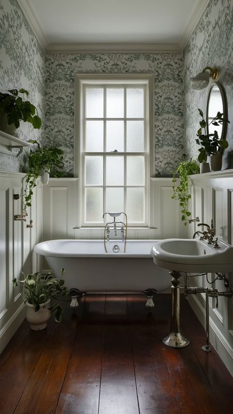 Discover a tranquil vintage bathroom with a clawfoot tub, floral wallpaper, and lush greenery. Perfect for relaxation and rejuvenation in your home. #BathroomDesign #VintageStyle Cottage Bathroom Clawfoot Tub, Small Clawfoot Tub Bathroom, Small Bathroom Clawfoot Tub, Vintage Clawfoot Tub Bathroom, Clawfoot Tub Bathroom Vintage, Clawfoot Tub Shower Combo, Small Bathroom With Clawfoot Tub, Bathrooms With Clawfoot Tubs, Clawfoot Tub Ideas