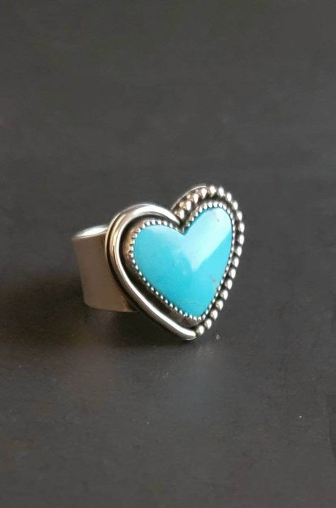 I have created this beautiful statement ring with 925 sterling silver.  I have chosen a gorgeous Bandit Mine turquoise that has been cut and designed by a fantastic artist and friend.  I've kept the design minimal.  As the stone needs no help for show. But to add a little drama to this one of a kind piece,  I chose to make a substantial band.  Absolutely fantastic wear. The ring measures 10 on the ring mandrel but fits a 9 1/2 due to the width of the band.  See pictures for size reference.  Ready to ship. Turquoise Heart Ring, Silversmithing Jewelry, Ring Mandrel, Silver Casting, Silver Turquoise Jewelry, Soldering Jewelry, Turquoise Boho, Turquoise Heart, Silver Jewelry Design