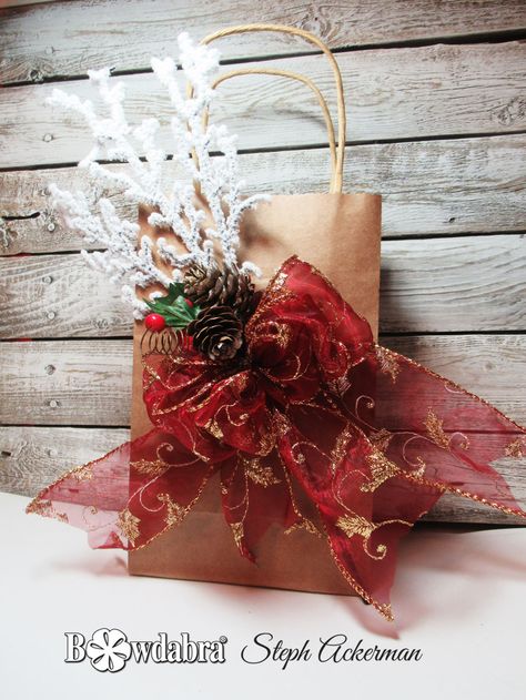 Hi everyone, Steph Ackerman is here to share how to decorate a holiday gift bag with Bowdabra. Bows For Gift Bags, Holiday Bags, Bow Making Tutorials, Decorated Gift Bags, Holiday Gift Bag, Holiday Bag, Bow Making, Gift Bows, How To Decorate