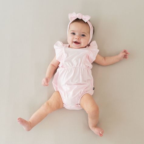 Our hearts are aflutter for this classic bubble romper that’s as cute as can be. Flutter sleeve details add the sweetest touch, while the bubble silhouette creates an adorable all-in-one outfit. Crafted from soft, stretchy bamboo, this lightweight romper keeps little ones cool and comfortable throughout the warmer months. 97% Bamboo Rayon, 3% Spandex Flutter sleeves Inseam snap closures Single snap closure at the back Bubble silhouette Baby Bubble Romper, Kyte Baby, Baby Bubble, Twirl Dress, The Bubble, Bubble Romper, Newborn Photoshoot, Sleeveless Bodysuit, Bamboo Fabric