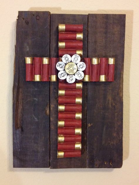 Medium wooden pallet plaque. The reclaimed pallet boards are stained with a dark danish oil and then topped with a cross made from fabricated 12 gauge shotgun shells. Dimensions are approximately 10" x 14". Each cross is handmade with love and truly one of a kind. Shotgun Shell Crafts, Bullet Crafts, Cross Crafts, Shotgun Shell, Recycled Pallets, Pallet Crafts, Wall Crosses, Unique Crafts, Shell Crafts