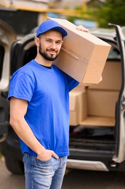 Portrait of delivery man carrying parcel... | Free Photo #Freepik #freephoto #man #box #packaging #delivery Carrying Boxes, Movers And Packers, Best Movers, Professional Movers, Delivery Photos, Junk Removal, Busy City, Packers And Movers, Moving Services