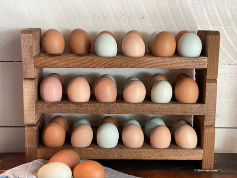 "These stackable egg holders are a great way to store your fresh unwashed eggs on your counter! They are made of cedar wood to last a long time. Each egg holder is hand-crafted with love. Do to the nature of hand-crafted items, no egg holder will be exactly like another and may have minor imperfections. We strive to give each customer a quality item that adds the rustic charm of farm-fresh eggs in their kitchen. If you have any questions about this item, please message us and we would be happy t Counter Egg Storage, Egg Holder Wood, Wood Egg Holder, Chicken Egg Holder, Wooden Egg Holder, Farmhouse Eggs, Egg Rack, Collecting Eggs, Fresh Egg