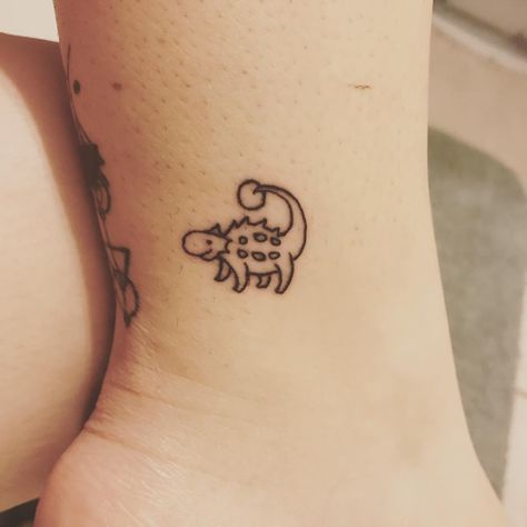 50+ Tiny Ankle Tattoos That Make the Biggest Statement Anklysaurus Tattoo, Tattoo Placement Bicep, Ankylosaurus Tattoo, Tiny Dino Tattoo, Small Dinosaur Tattoo, Dino Tattoo, Matching Best Friend Tattoos, Tattoo Apprenticeship, Dinosaur Tattoos