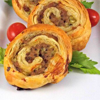 Sausage Pinwheels | Allrecipes Sausage Pinwheels, Puff Pastry Pinwheels, Pinwheels Recipe, Cheese Twists, Sausage Rolls Recipe, Homemade Pesto Sauce, Puff Pastry Appetizers, Cheese Pinwheels, Goat Cheese Tart