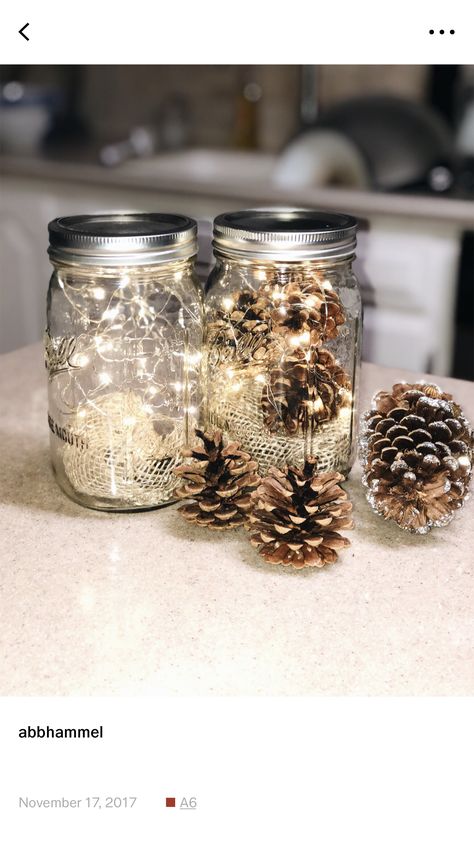 Clear Jar Decor, Christmas Lights In Mason Jars, Jars With Lights Inside Christmas, Jars With Lights Inside, Lights In A Jar, Fairy Light Christmas Vase, Pinecone Lights Vase, Christmas Mason Jar With Fairy Lights, Winter Feast