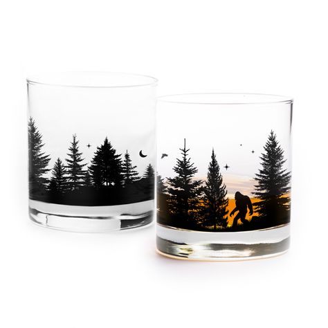 "These bigfoot themed whiskey glasses showcase an original illustration that wraps around 4/5 of the glass and showcases a wandering squatch in a dense pine forest at night! These glasses are the perfect gift for any bigfoot enthusiast, or skeptic, and are sure to get a few comments regardless of where they are loved! All glassware comes packaged in a retail display boxes ready for gifting!  All of our glasses are manufactured in the US and printed by hand in our Colorado shop! 11oz. Tumbler Gla Different Hat Styles, Sasquatch Gifts, Forest At Night, Black Lantern, Tumbler Glass, 3d Cnc, Night Forest, Whiskey Glasses, Estes Park