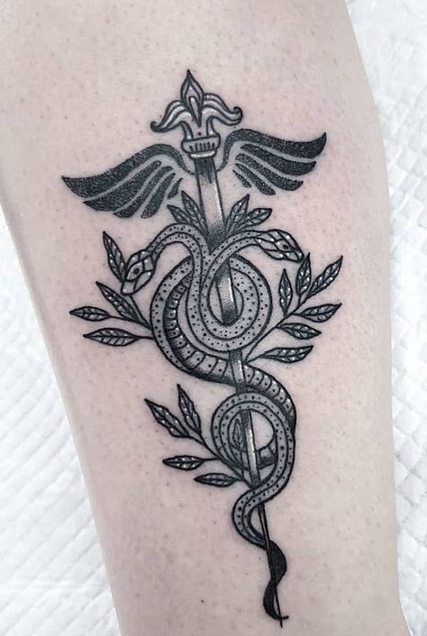 The caduceus RN symbol tattoo by @wanderingwitchtattoo Nurse Caduceus Tattoo, Medical Staff Tattoo, Nursing Symbol Tattoo, Medical Inspired Tattoos, Subtle Nurse Tattoo, Nurse Practitioner Tattoo Ideas, Psych Nurse Tattoo, Caduceus Tattoo Feminine, Healthcare Tattoo Ideas