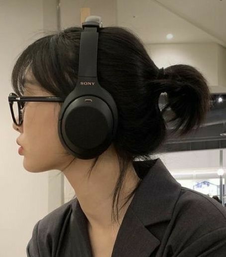 A Woman, Headphones, Mirror