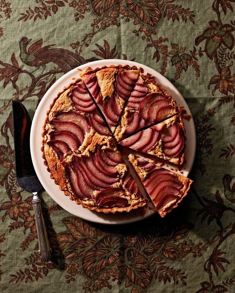 Poached-Pear Frangipane Tart | Pears are poached in mulled wine here, infusing the fruit with spices and giving the exteriors a deep crimson hue. When sliced and nestled into a rich frangipane filling, they create a gorgeous ombre effect.  #food #recipe #marthastewart #pierecipes #thanksgivingrecipes Chocolate Chess Pie, Pie And Tart, Frangipane Tart, Tart Filling, Beautiful Recipes, Poached Pears, Thanksgiving Pies, Sweets Candy, Pie Tart