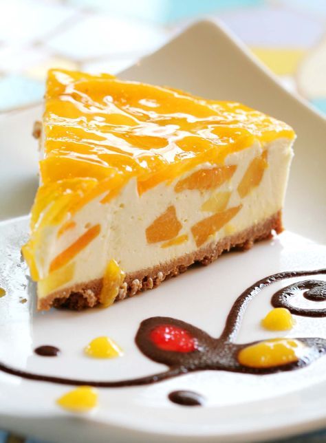 Mango Cheesecake is a beautiful, delicate dish that is perfect for parties and special occations. The Mango Cheese Cake Recipe is makde by blending the delectable fresh mangoes with crumbly cheese. The pastry for the cheese cake has a prefect crust and is a great way to enjoy the healthy and yummy yellow fruit. Serve it as a dessert for a party and this sinfully decadent pastry is sure to make your guests want for more. Peach Cheesecake, Cheesecake Factory Recipes, Fig Cake, Banana Cheesecake, Mango Cheesecake, Nutella Cheesecake, Mango Dessert, Peach Cake, Mango Recipes