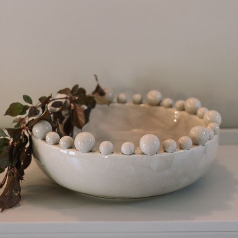 Cream ceramic bobble bowl with purple foliage. Spring Edit, White Ceramic Bowl, Wood And Ceramic, Small Pleasures, Summer Must Haves, Clay Christmas, House Color Schemes, Table Scape, Christmas Inspo