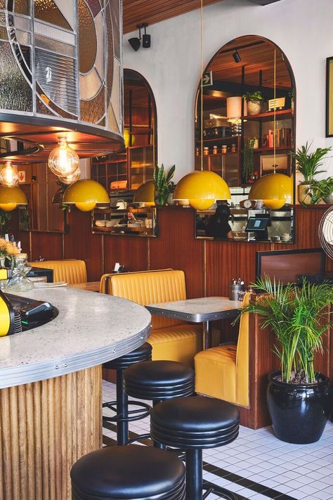 Yellow retro-inspired interior of Egghead Diner in Cape Town, South Africa Retro Diner Decor, Yellow Restaurant, Eclectic Restaurant, Diner Restaurant, 70s Interior, Diner Decor, Bar Design Awards, Decoration Restaurant, Retro Cafe