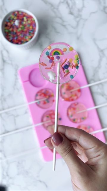 Rita Tohmé-Kikano on Instagram: "🍭 How to: Making Lollipops🍭 These next few weeks I will share with you my tricks and treats *See what I did here* for easy celebration ideas! Ingredients for the lollipops: Canola Oil 1 cup sugar 1/2 cup light corn syrup 1/4 cup water 1 1/2 teaspoons extract (I used Raspberry extract) Full Recipe in Comments" Sucker Recipe Homemade Lollipops, Making Lollipops, Lollipops Diy, Raspberry Extract, Celebration Ideas, Christmas School, Candy Making, Canola Oil, Girl Cakes