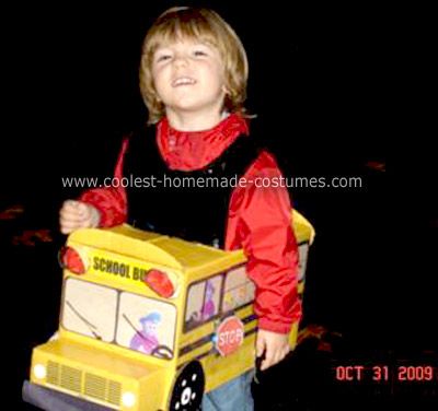 Homemade School Bus Costume: I am a bus driver and my son rides with me. He just loves school buses. So, the only costume suitable for him was a Homemade School Bus Costume. Since Wheels On The Bus Halloween Costume, Diy Bus Costume, Magic School Bus Couples Costume, Cardboard Bus Costume, Magic School Bus Halloween Costumes, Cardboard Vehicles, School Bus Costume, Costume Homemade, Fancy Dress Competition