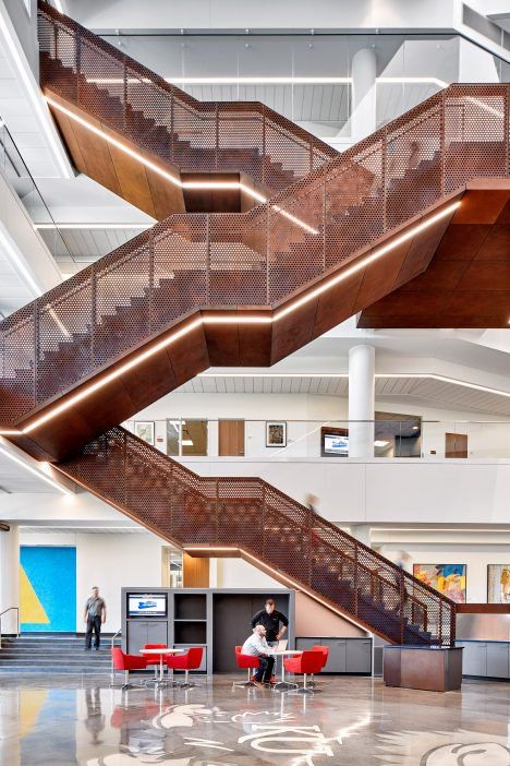 A grand staircase with perforated metal railings zigzags up through the four-storey atrium in a new university building in Kansas by Gensler. Monumental Stair, Industrial Staircase, Arch Stairs, Interior Design Schools, Design Stairs, Stairs Architecture, Stair Design, Steel Stairs, Weathering Steel