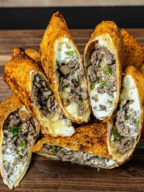 Philly Cheesesteak Egg Rolls Philly Cheesestake Egg Rolls, Chicken Philly Cheesesteak Eggrolls, Philly Cheese Steak Roll Ups, Puff Pastry Egg Rolls, Cheese Steak Egg Rolls Air Fryer, Egg Rolls Filled With Philly Cheesesteak, Philly Cheesecake Eggrolls, Dinner Egg Rolls, Mushroom Egg Rolls