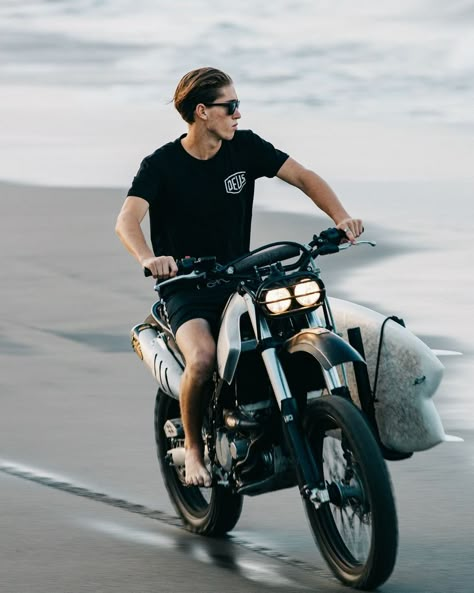 Deus Ex Machina Bali Indonesia on Instagram: “Eyes on the prize. Surf hunting along the shores. Image by @harrymarkphoto #deustemplebikes” Dues Ex Machina, Surfboard Bike Rack, Deus Ex Machina Motorcycles, Trail Vintage, Surf Cafe, Surf Bike, Adventure Bike Motorcycles, Dr 650, Motor Trail