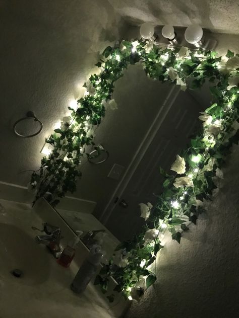 Vine Around Mirror, Mirror With Fairy Lights Around It, Fairy Lights On Mirror, Vines Over Mirror, Mirror Wall Decor With Flowers, Flower Framed Mirror, Fake Vines In Bathroom, Leaves Around Mirror, Vines In Office