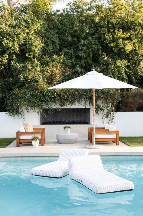 Looking to elevate your backyard with a pool? Consider adding a chic poolside bar for refreshing drinks and a cozy fire pit for evening gatherings. Incorporate comfy seating and some colorful cushions to make the area inviting. Your backyard will become the go-to spot for entertaining and relaxation! #backyardinspiration #poolsideideas #backyardgoals Luxury Pool Floats, Oliver James, Luxurious Pool, Modern Pools, Building A Pool, Outside Living, Luxury Pool, Backyard Inspo, Pool Furniture