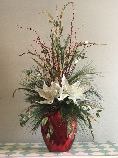 This is centerpiece pretty enough to brighten any corner of your home Christmas Floral Arrangements Diy, Winter Flower Arrangements, Dekoratívne Vence, Winter Floral Arrangements, Winter Arrangements, Christmas Flower Arrangements, Christmas Planters, Church Flower Arrangements, Home Floral Arrangements