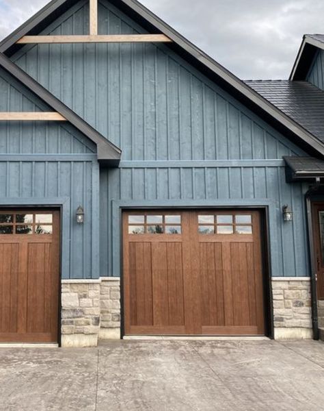 Garage Siding Ideas Exterior Colors, Blue House With Brown Garage Door, Brown And Blue House Exterior, Dusty Blue Exterior House, Blue House Brown Trim, Navy Brick House Exterior, House Exterior Lighting Ideas, Dark Blue Siding House, Grey Blue Exterior House Colors