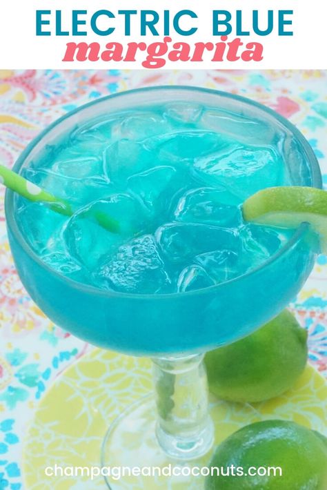 A classic drink, the electric blue margarita made with blue curacao is sure to hit the spot. Served on the rocks, it's so easy to make. #bluemargarita #electricmargarita #margarita #bluecuracao #tequila #ontherocks #cocktails | champagneandcoconuts.com Blue Margarita Recipe Pitcher, Blue Curacao Recipe, Blue Margaritas, Blue Margarita Recipe, Pitcher Margarita Recipe, Blue Tequila, Blue Curacao Liqueur, Blue Margarita, Blue Drinks