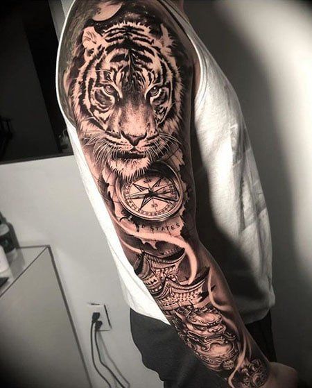 110 Coolest Tiger Tattoo Designs in 2022 - The Trend Spotter Arm Tattoos Tiger, Arm Sleeve Tattoo Ideas, Mens Tiger Tattoo, Arm Sleeve Tattoo, Tiger Tattoo Sleeve, Animal Sleeve Tattoo, Lion Tattoo Sleeves, Sleeve Tattoo Ideas, Tiger Tattoo Design