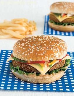 The veggie burger is one of the most common burgers around, but let me tell you upfront that this recipe is not a run-of-the-mill one! it is a wonderful indo-western combo, as the tikki imbibes true indian spices while the spread uses chilli sauce and oregano to perk up the mayonnaise. Also, unlike the common burgers in which the vegetables are boiled, here we use raw vegetables sautéed to perfection. The complementary colours of the capsicum and potatoes in the salad ensure that it looks ver... Broccoli Burger, Veg Burgers Recipe, Veg Burger, Veggie Burger Recipe, Best Veggie Burger, Dill Potatoes, Veggie Burgers Recipe, Vegetarian Burger, Burger Recipe