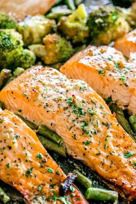 Garlic Butter Baked Salmon. Family-friendly Sheet Pan Suppers. Easy dinner recipes for moms on the go!  #dinners #suppers #sheetpan #dinnerrecipes #recipeshealthy #easydinnerrecipes #easyrecipe #sheetpandinners #sheetpanrecipes #supperideas #garlicbutter #bakedsalmon Baked Salmon Sheet Pan Dinner, Salmon And Broccoli Recipes, Salmon Recipes Oven, Delicious Salmon Recipes, Salmon And Broccoli, Keto Salmon, Garlic Butter Salmon, Oven Baked Salmon, Butter Salmon