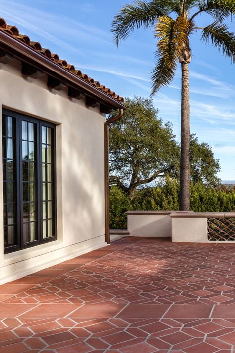 The Monrovia Red ceramic tiles on the patio complement the red tile roof perfectly. The design: Picket Set by Rich Starley IDS in Long Beach, CA. #outdoorlivingspace #spanishstylehome #spanishrevival #artobrick Spanish House Exterior, Red Tile Roof, Mediterranean Interior Design, Tile Roof, Mediterranean Interior, Red Tiles, Spanish Style Home, Red Ceramic, Glazed Tiles