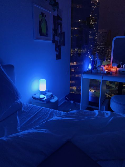 room with blue ambient blue lighting and floor to ceiling windows looking into the city Blue Room Asthetics, Downtown Asthetics, Room Ideas Aesthetic Purple, Aesthetic Purple Bedroom, Apartment Asthetics, Vibe Room Ideas, Neon Room Ideas, Room Asthetics, Living Room Minecraft