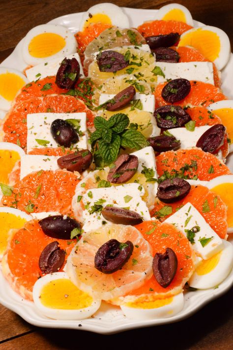 Kosovo Sallate is a delicious citrus salad that is light and refreshing. It has both sweet oranges and tangy lemon, it is then combined with some white brined cheese and hard boiled eggs.  Topped with salty brined black olives along with some fresh mint.  The whole salad is then drizzled with ... Kosovo Food, Spring Dinner Party, Albanian Food, Balkan Countries, Albanian Recipes, Culture Recipes, Board Recipes, Lemon Cheese, Around The World Recipes