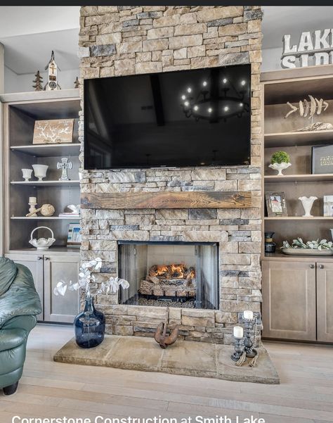 Stone Fireplace And Tv Wall Ideas, Stone Fireplace To Ceiling With Tv, Hidden Room Behind Fireplace, Rock Fireplace Built Ins, Rock Wall With Tv And Fireplace, Stack Stone Fireplace With Built Ins, Grey Stone Fireplace With Built Ins, Brown Couch With Rug Ideas, Stacked Stone Fireplace With Built Ins On Both Sides