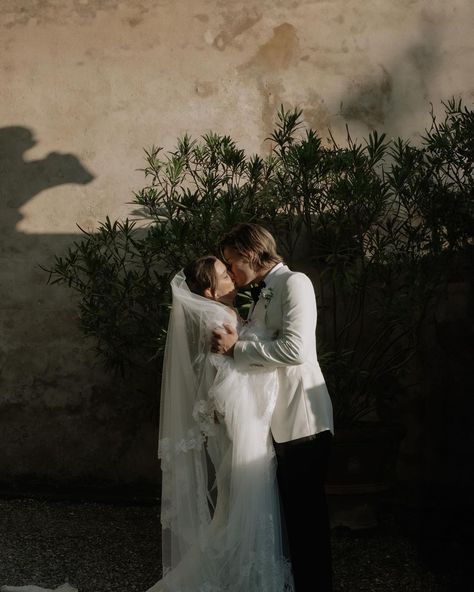 @milliebobbybrown and @jakebongiovi are married! The newlyweds tied the knot this past spring in Italy and just gave us a look inside their intimate ceremony, attended by the couple’s parents, including the legendary musician Jon Bon Jovi and his wife Dorothea Bongiovi. The bride wore a @galialahav gown and the groom wore @tomford for their fairytale wedding, planned by @camillaboniekevents. Tap the link in bio for more details. Photo: @divinedayphotography Millie Bobby Brown Wedding, Jake Bongiovi, Happy Hour Specials, Brown Wedding, Brown Tie, Tuscany Wedding, Second Weddings, Jon Bon Jovi, Gowns Of Elegance