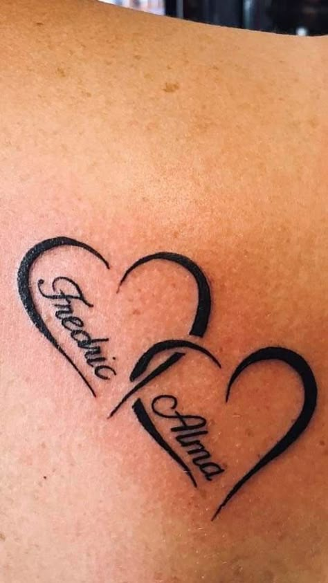 Family Tattoos With Names, Hearts With Names Tattoos, Grand Kids Tattoo Ideas, 2 Heart Tattoo Designs, Heart Tattoo Designs With Names, Tattoo Of Kids Names For Women, Two Kids Tattoo Ideas, Grandson Tattoos For Grandma, Children Name Tattoo Ideas For Women