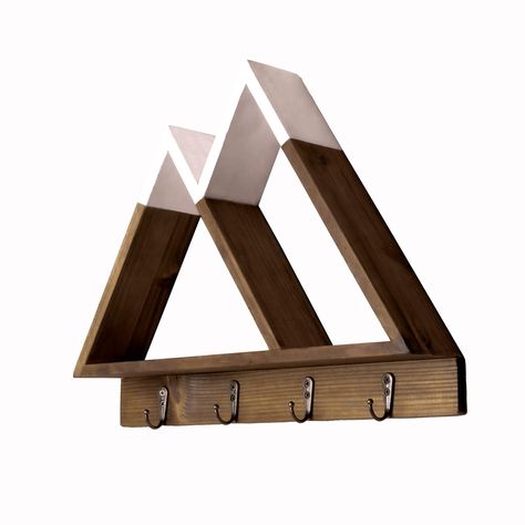 PRICES MAY VARY. Multi-Function. Our modern Twin Peak floating mountain shelf is not just great to look at but is also a fantastic high quality wall organizer allowing you to store letters, sunglasses and wallets. Showcase plants and crystals or use as an essential oil shelf in the bathroom. With the added benefit of 4 hooks you’ll be able to organize Keys, hats, necklaces, jewelry, medals and ribbons - making sure you’ll know where they’re kept everytime. Unique Design. Not only a fantastic org Entryway Floating Shelves, Mountain Nursery Wall, Mountain Shelf, Adventure Theme Nursery, Essential Oil Shelf, Mountain Nursery, Locker Decorations, Adventure Nursery, Triangle Shelf