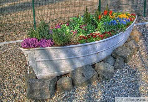 22 Landscaping Ideas to Reuse and Recycle Old Boats for Yard Decorations.  Going to try this out by a big boulder in my yard  Will remove the windshield though! Boat Garden, Old Boats, Lake House Ideas, Garden Yard Ideas, Outside Ideas, Container Gardens, Yard And Garden, Garden Stuff, Garden Yard