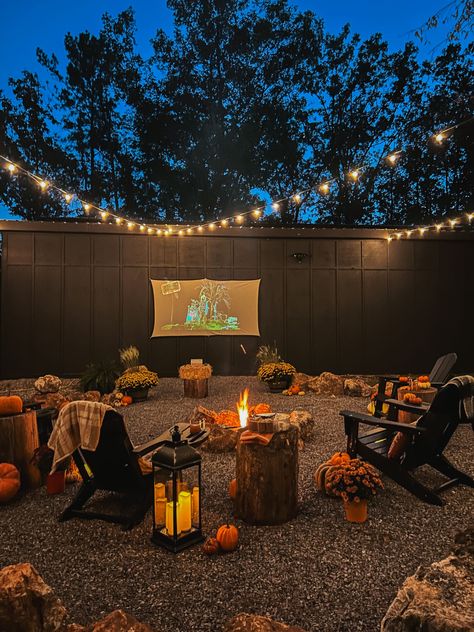 We recently added an awesome fire pit area to the side of our barn. It is a great space to hang out under the trees and twinkle lights and watch a movie on the projector screen. As you know, Fall i… Fall Fire Pit, Fire Pit Yard, The Projector, Old Time Pottery, Ghost Diy, Outdoor Projector, Halloween Front Porch, Fire Pit Area, Pumpkin Pillows