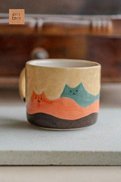 Cat-shaped mountain design ceramic mug, Whimsical cat landscape hand-painted mug, Artistic feline mountain coffee cup, Unique cat silhouette mountain mug, Handcrafted mug with playful cat mountains, Nature-inspired ceramic mug with cat accents, Creative cat mountain scene coffee cup, Ceramic coffee mug with whimsical cat hills, Collectible artisan mug with mountain cats, Quirky cat mountain artwork on ceramic mug, Ceramic mug Cat Mug Pottery, Cat Pottery Painting, Cat Pottery, Cat Landscape, Diy Pottery Painting, Mountain Coffee, Ceramic Glaze Recipes, Men Coffee, Tanah Liat